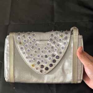 Stylish Silver Handbag with Eyelet Design